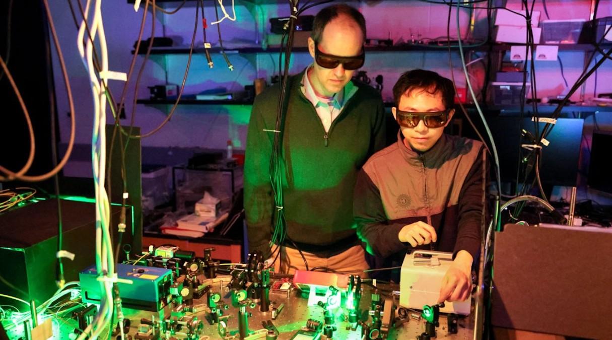 two engineers work in laser lab